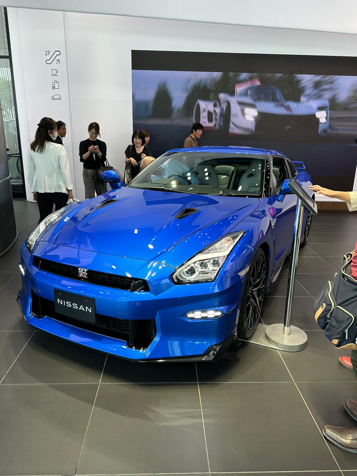 A blue Nissan GT-R on display inside a Nissan dealership in Tokyo