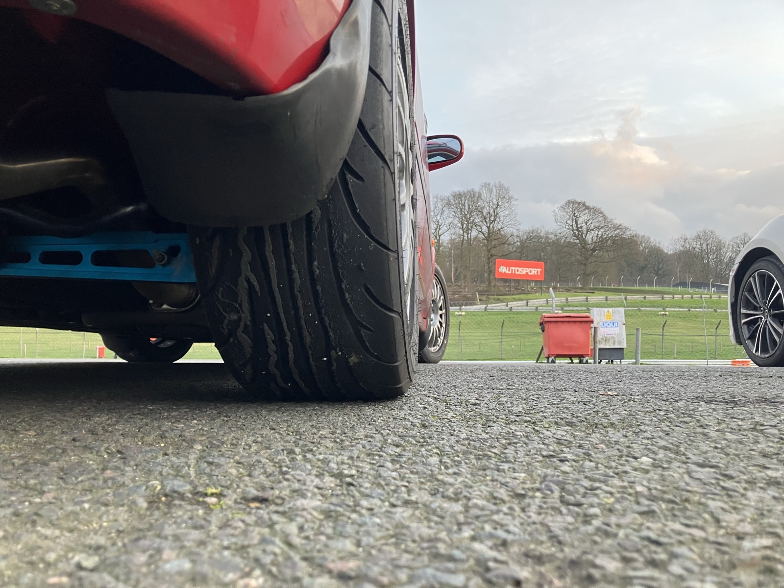 Low angle shot of the front wheel and tire of the Civic EK at the trackside at Brands Hatch