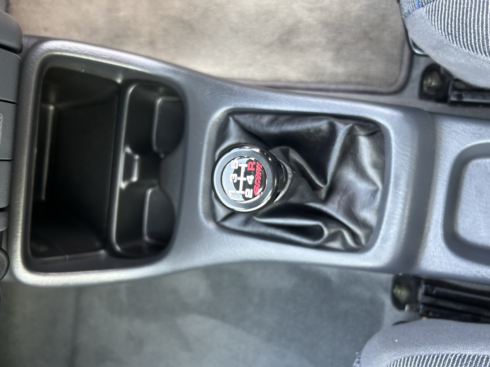 A Spoon Sports shift knob on the gear lever of the Civic EK